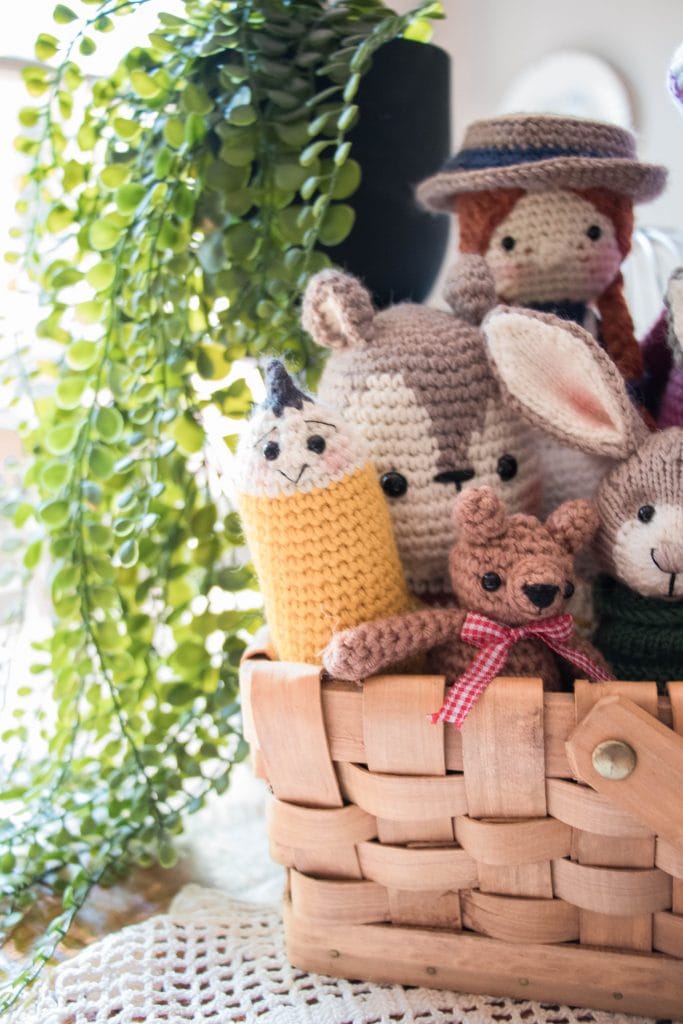 Crocheted and knitted toys in a box.