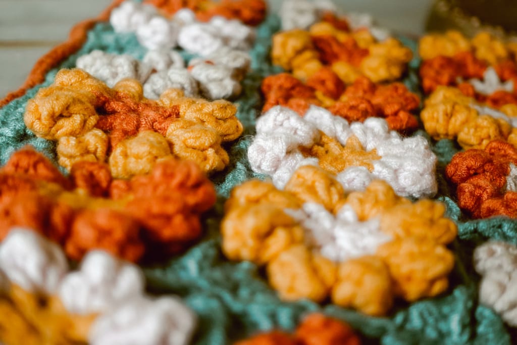 Close Up of Fall Floral Crochet Granny Squares